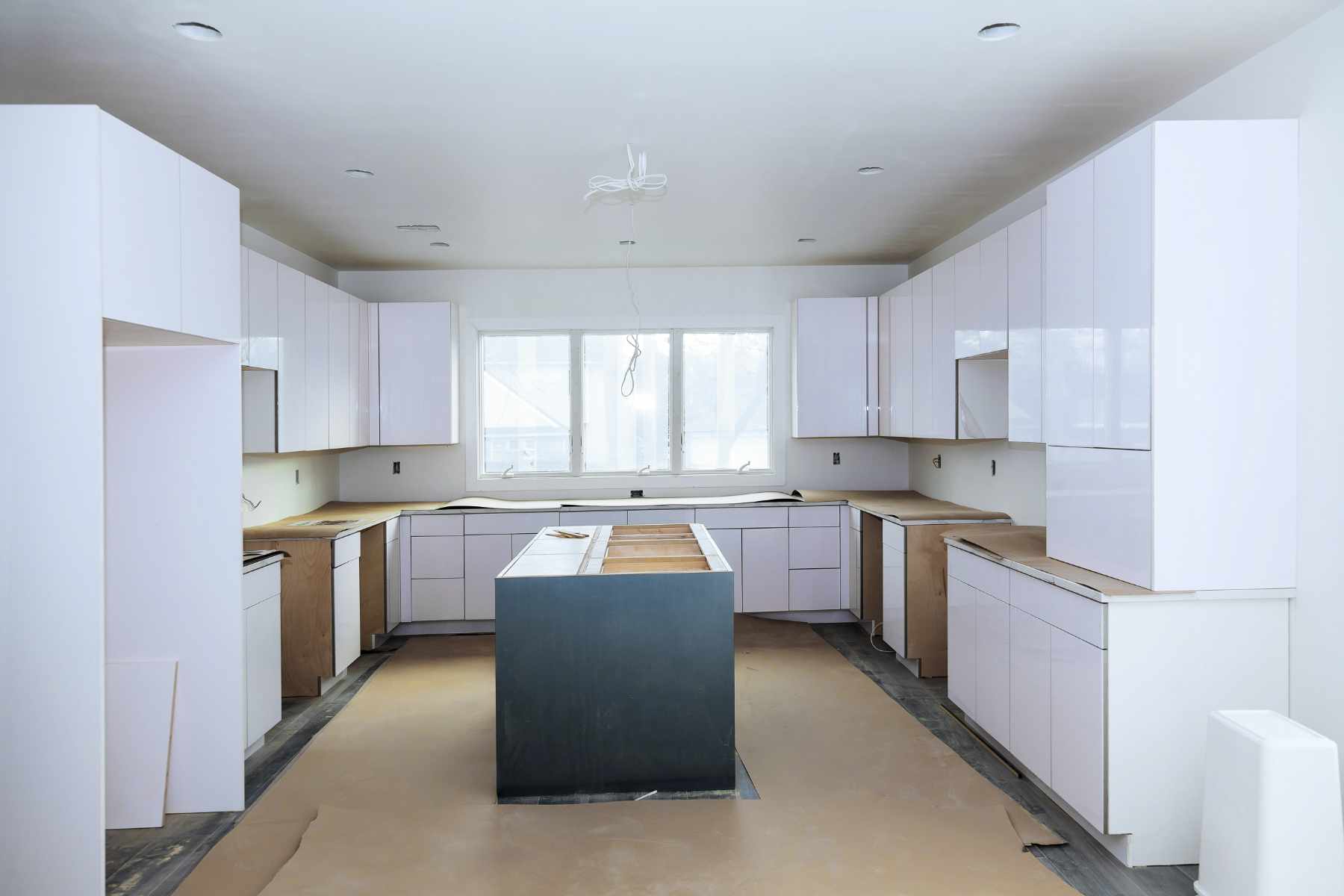 Installation of custom kitchen cabinets a white color in new house